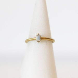 Elizabeth Street Baguette Diamond Solitaire Ring in 18K yellow gold with claw prongs